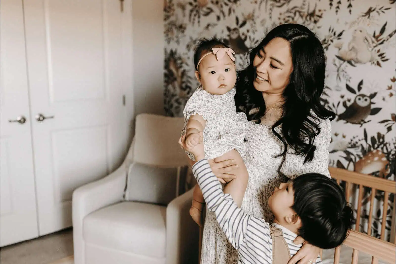 Happy multicultural family with children, surrogate motherhood concept, smiling woman with kids.