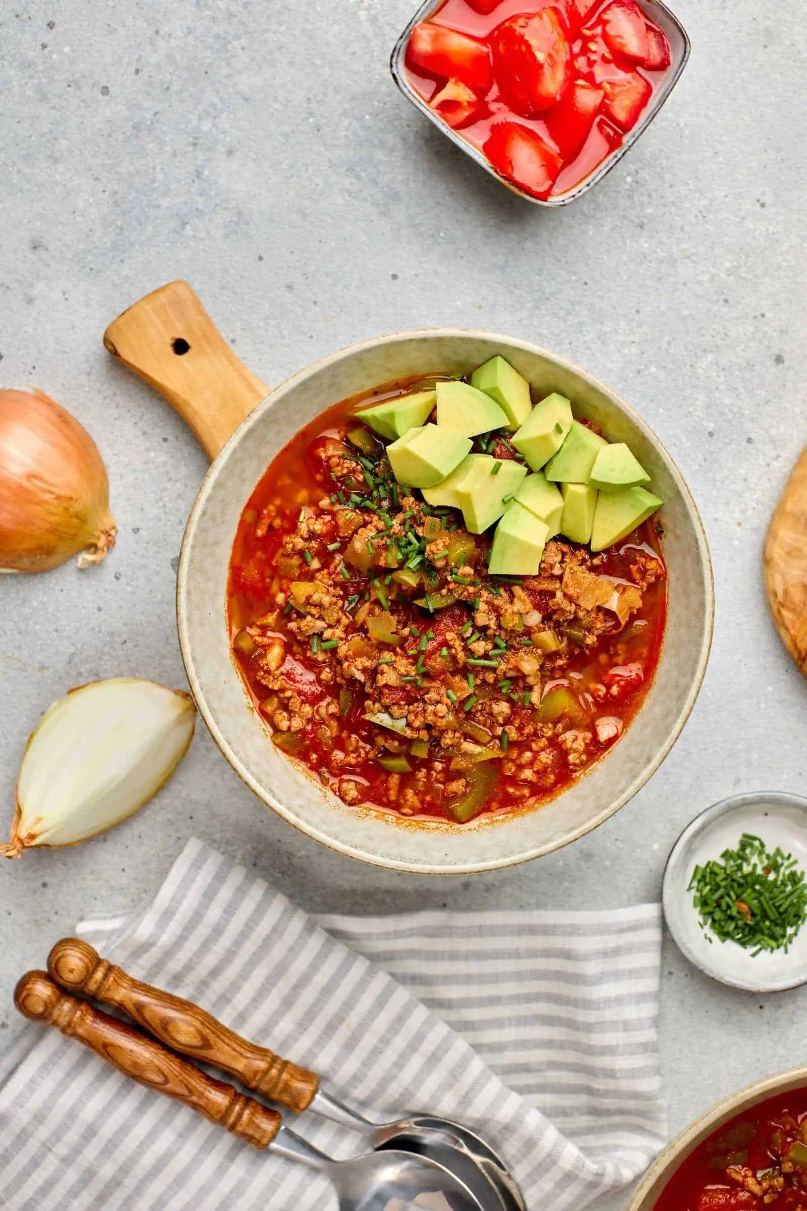 Savory taco soup with avocado and fresh ingredients, perfect for comforting meals.