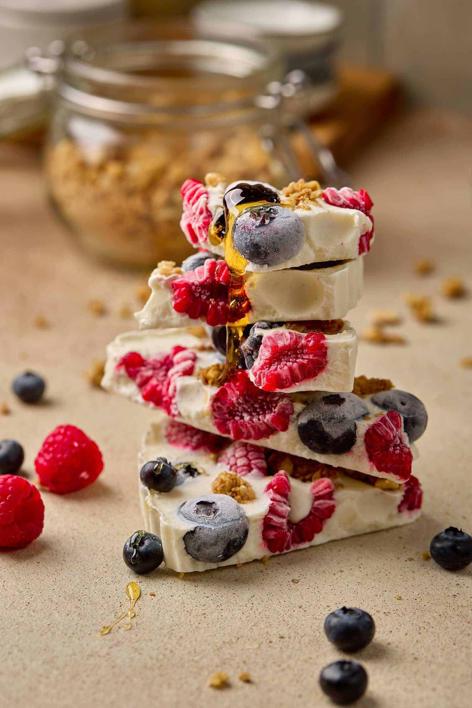 Delicious cheesecake layered with fresh blueberries, raspberries, and blackberries, topped with golden honey. Perfect dessert for sharing.