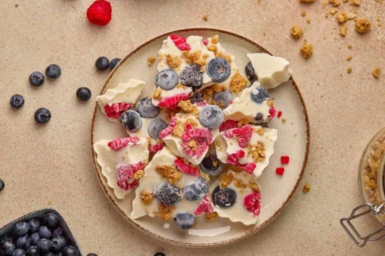 Fresh berries and yogurt on a rustic plate for healthy dessert or snack. Perfect for summer or breakfast.