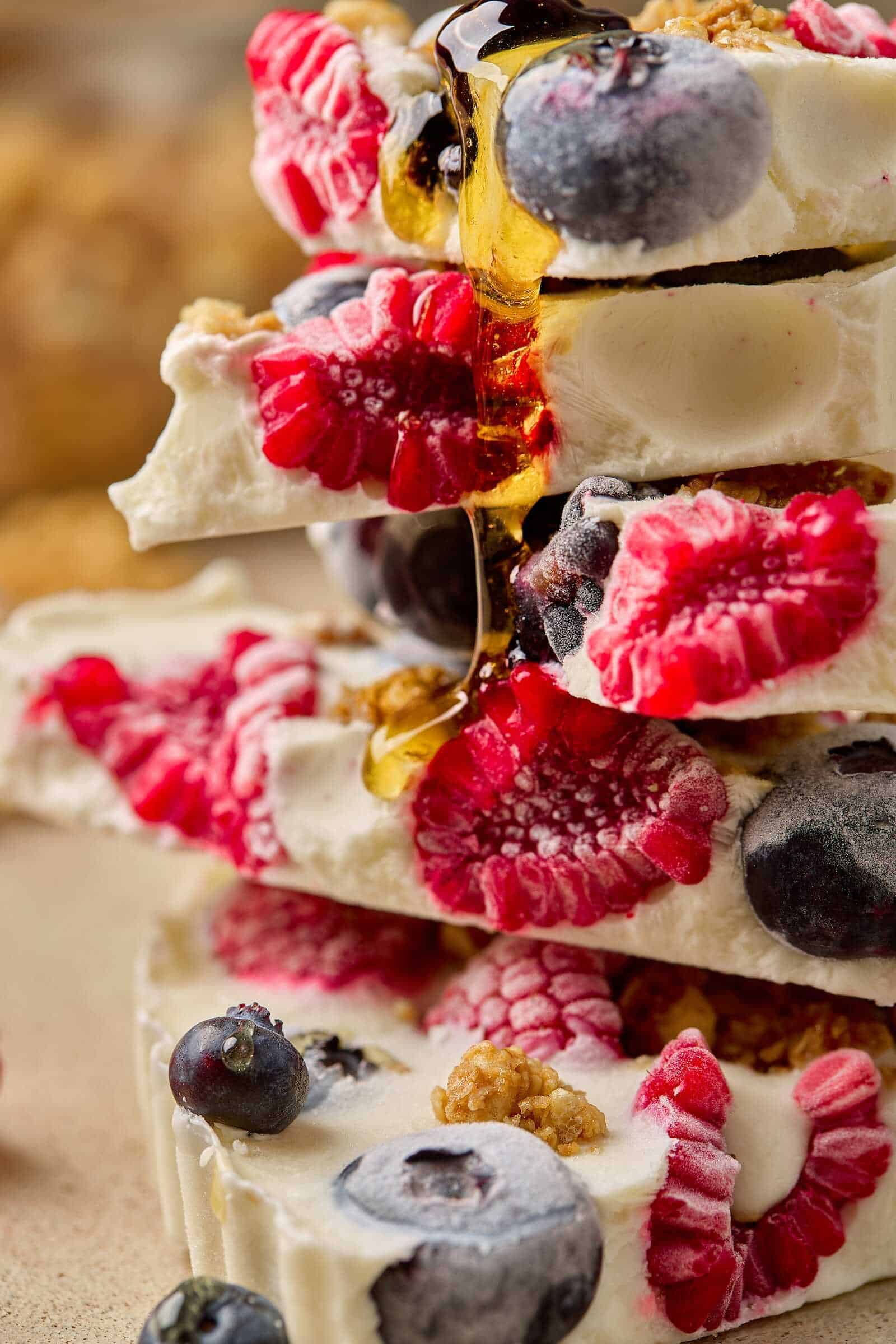 Fresh berries and creamy white chocolate layered dessert with honey drizzle.