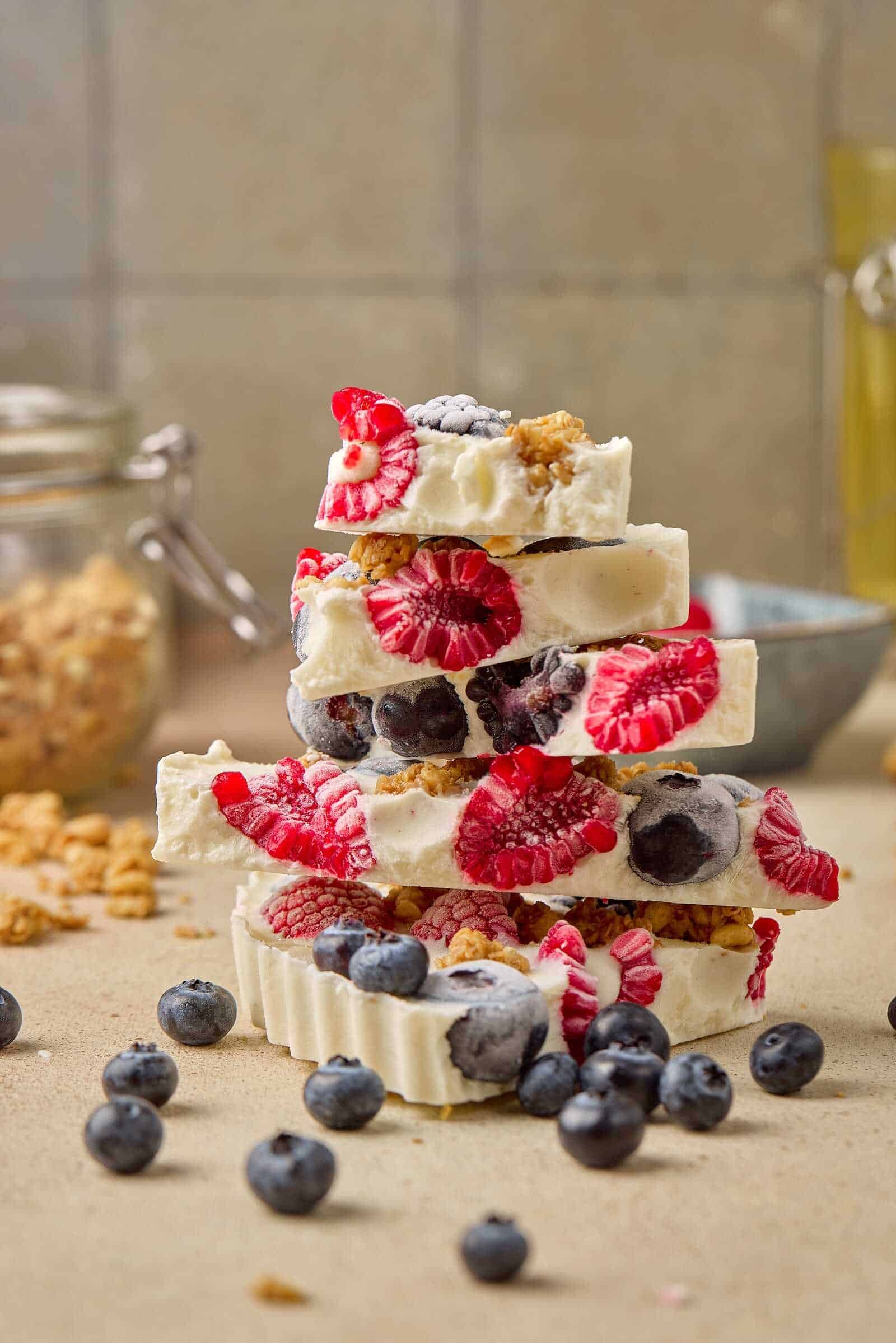 Delicious homemade chocolate bars topped with fresh blueberries, raspberries, and blackberries, ideal for surrogacy milestones.